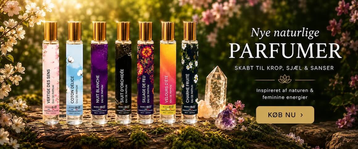 Elegant banner med naturlige Born to Bio parfumer omgivet af blomster og krystaller i varm naturstemning &ndash; eksklusive dufte hos Gaia Sten & Krystaller.