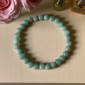 Amazonit krystalarmb�nd � 7 mm perler | St�tter sandhed, ro & balance