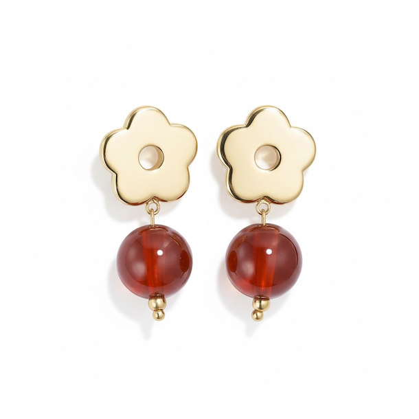 Forgyldte �restikker med blomstermotiv og varme orange resinperler