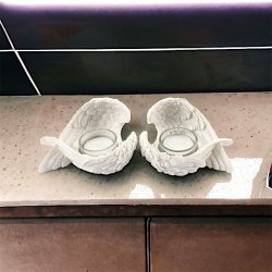 Fyrfadsstager med englevinger