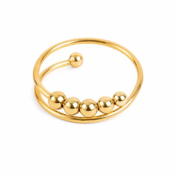 Guldfarvet stressring med fem flytbare kugler p� hvid baggrund
